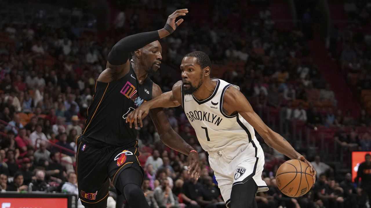 MIAMI, FLORIDA - MARCH 26: Kevin Durant #7 of the Brooklyn Nets drives to the basket while being defended by Bam Adebayo #13 of the Miami Heat during the first half at FTX Arena on March 26, 2022 in Miami, Florida. NOTE TO USER: User expressly acknowledges and agrees that, by downloading and or using this photograph, User is consenting to the terms and conditions of the Getty Images License Agreement.