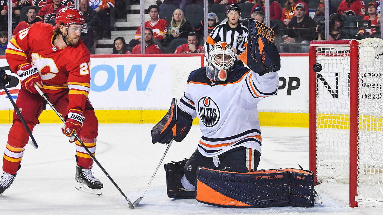 CALGARY, AB - MARCH 26: Mike Smith #41 of the Edmonton Oilers stops a shot from Blake Coleman #20 of the Calgary Flames during the third period an NHL game at Scotiabank Saddledome on March 26 2022 in Calgary, Alberta, Canada. The Calgary Flames defeated the Edmonton Oilers 9-5.