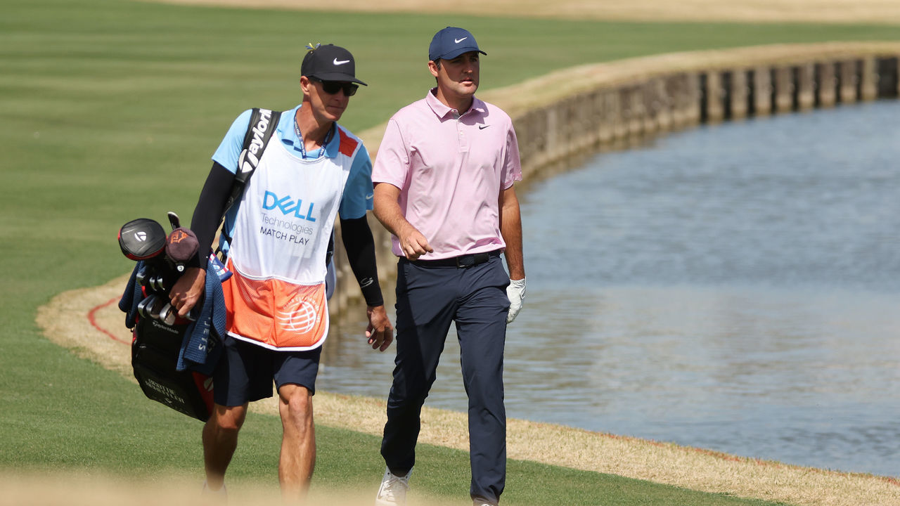 AUSTIN, TEXAS - MARCH 27: Scottie Scheffler of the United States and his caddie Ted Scott walk to the 13th green in his semifinal match against Dustin Johnson of the United States on the final day of the World Golf Championships-Dell Technologies Match Play at Austin Country Club on March 27, 2022 in Austin, Texas.