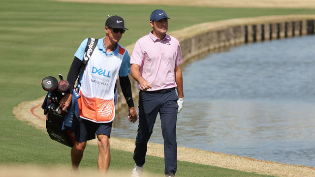AUSTIN, TEXAS - MARCH 27: Scottie Scheffler of the United States and his caddie Ted Scott walk to the 13th green in his semifinal match against Dustin Johnson of the United States on the final day of the World Golf Championships-Dell Technologies Match Play at Austin Country Club on March 27, 2022 in Austin, Texas.