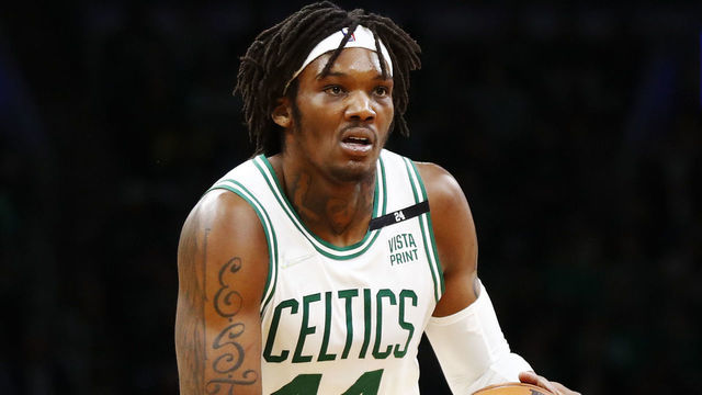 BOSTON, MASSACHUSETTS - MARCH 11: Robert Williams III #44 of the Boston Celtics brings the ball up court during the fourth quarter of the game against the Detroit Pistons at TD Garden on March 11, 2022 in Boston, Massachusetts.