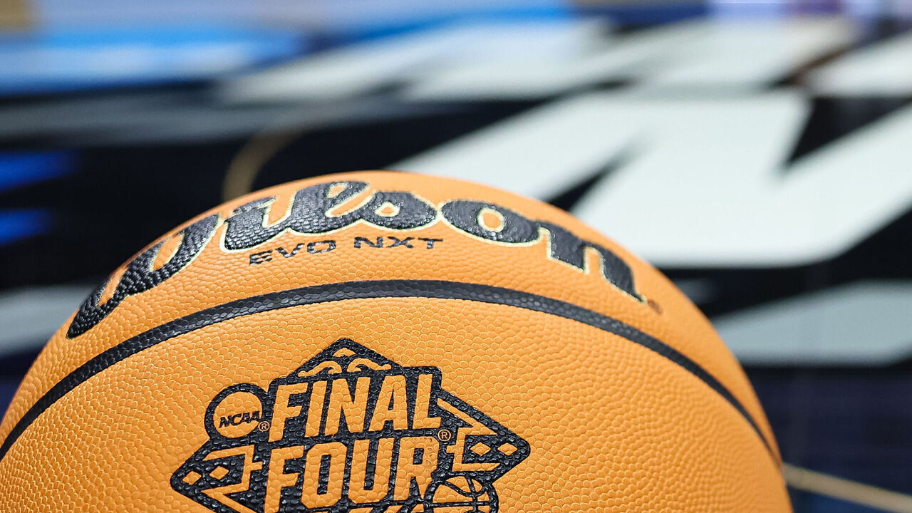 PHILADELPHIA, PA - MARCH 27: A general view of a basketball with the Final Four logo on the court before the Elite Eight round of the 2022 NCAA Men"u2019s Basketball Tournament game between the North Carolina Tar Heels and the St. Peter's Peacocks held at Wells Fargo Center on March 27, 2022 in Philadelphia, Pennsylvania.