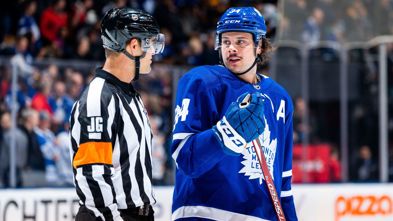 TORONTO, ON - FEBRUARY 20: Auston Matthews #34 of the Toronto Maple Leafs talks to referee Jean Hebert #15 at an NHL game against the Pittsburgh Penguins during the first period at the Scotiabank Arena on February 20, 2020 in Toronto, Ontario, Canada.
