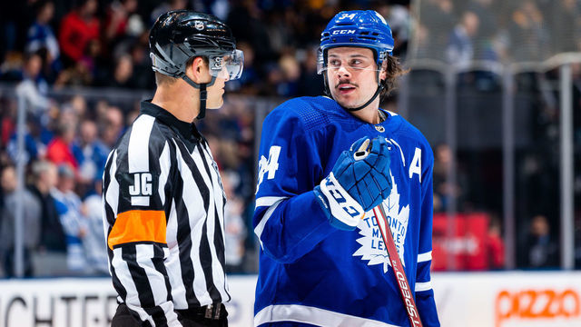 TORONTO, ON - FEBRUARY 20: Auston Matthews #34 of the Toronto Maple Leafs talks to referee Jean Hebert #15 at an NHL game against the Pittsburgh Penguins during the first period at the Scotiabank Arena on February 20, 2020 in Toronto, Ontario, Canada.