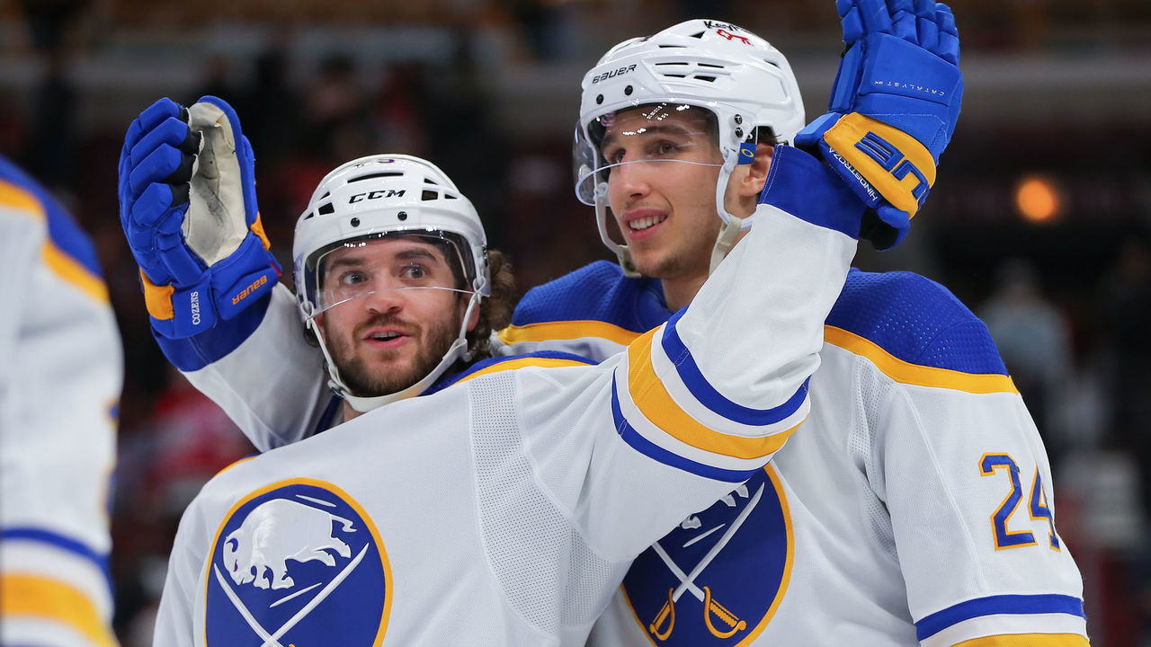 CHICAGO, IL - MARCH 28: Buffalo Sabres center Vinnie Hinostroza (29) and Buffalo Sabres center Dylan Cozens (24) celebrate after a game between the Buffalo Sabres and the Chicago Blackhawks on March 28, 2022 at the United Center in Chicago, IL.