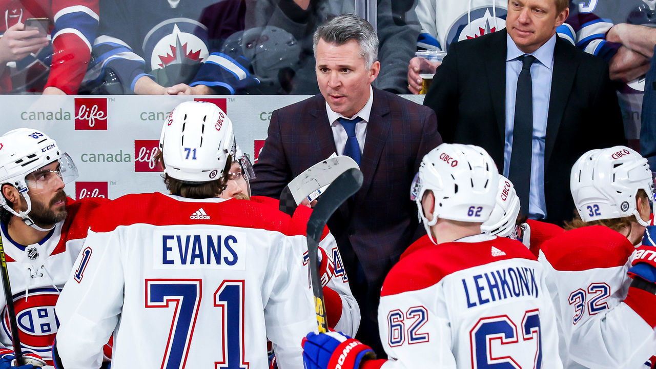 WINNIPEG, MB - MARCH 1: Interim Head Coach Martin St-Louis of the Montreal Canadiens gives instructions to Jake Evans #71 during a third period stoppage in play against the Winnipeg Jets at the Canada Life Centre on March 1, 2022 in Winnipeg, Manitoba, Canada.