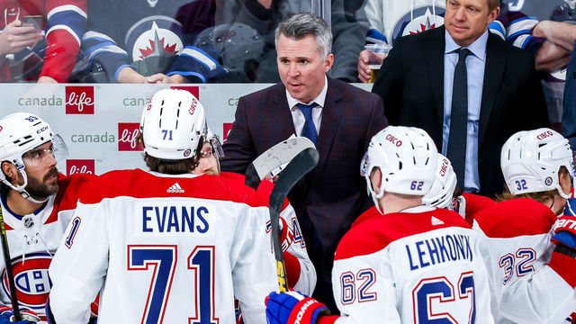 WINNIPEG, MB - MARCH 1: Interim Head Coach Martin St-Louis of the Montreal Canadiens gives instructions to Jake Evans #71 during a third period stoppage in play against the Winnipeg Jets at the Canada Life Centre on March 1, 2022 in Winnipeg, Manitoba, Canada.