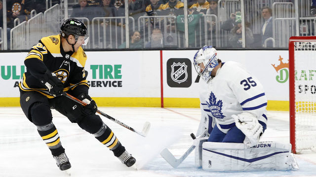 BOSTON, MA - MARCH 29: Toronto Maple Leafs goalie Petr Mrazek (35) makes a save on Boston Bruins defenseman Hampus Lindholm (27) during a game between the Boston Bruins and the Toronto Maple Leafs on March 29, 2022, at TD Garden in Boston, Massachusetts.