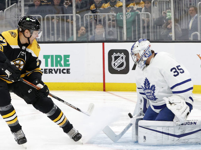 BOSTON, MA - MARCH 29: Toronto Maple Leafs goalie Petr Mrazek (35) makes a save on Boston Bruins defenseman Hampus Lindholm (27) during a game between the Boston Bruins and the Toronto Maple Leafs on March 29, 2022, at TD Garden in Boston, Massachusetts.