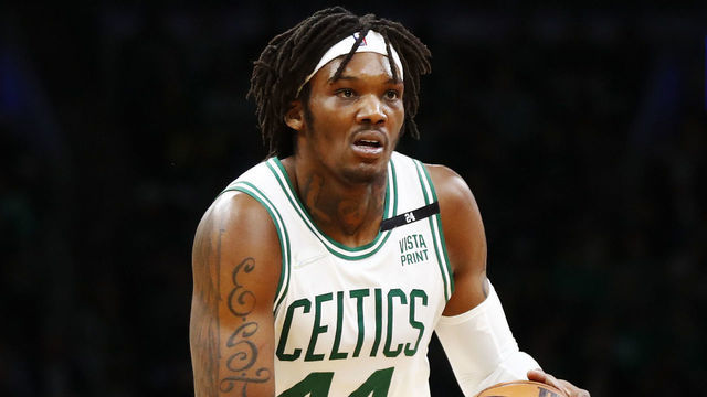 BOSTON, MASSACHUSETTS - MARCH 11: Robert Williams III #44 of the Boston Celtics brings the ball up court during the fourth quarter of the game against the Detroit Pistons at TD Garden on March 11, 2022 in Boston, Massachusetts.
