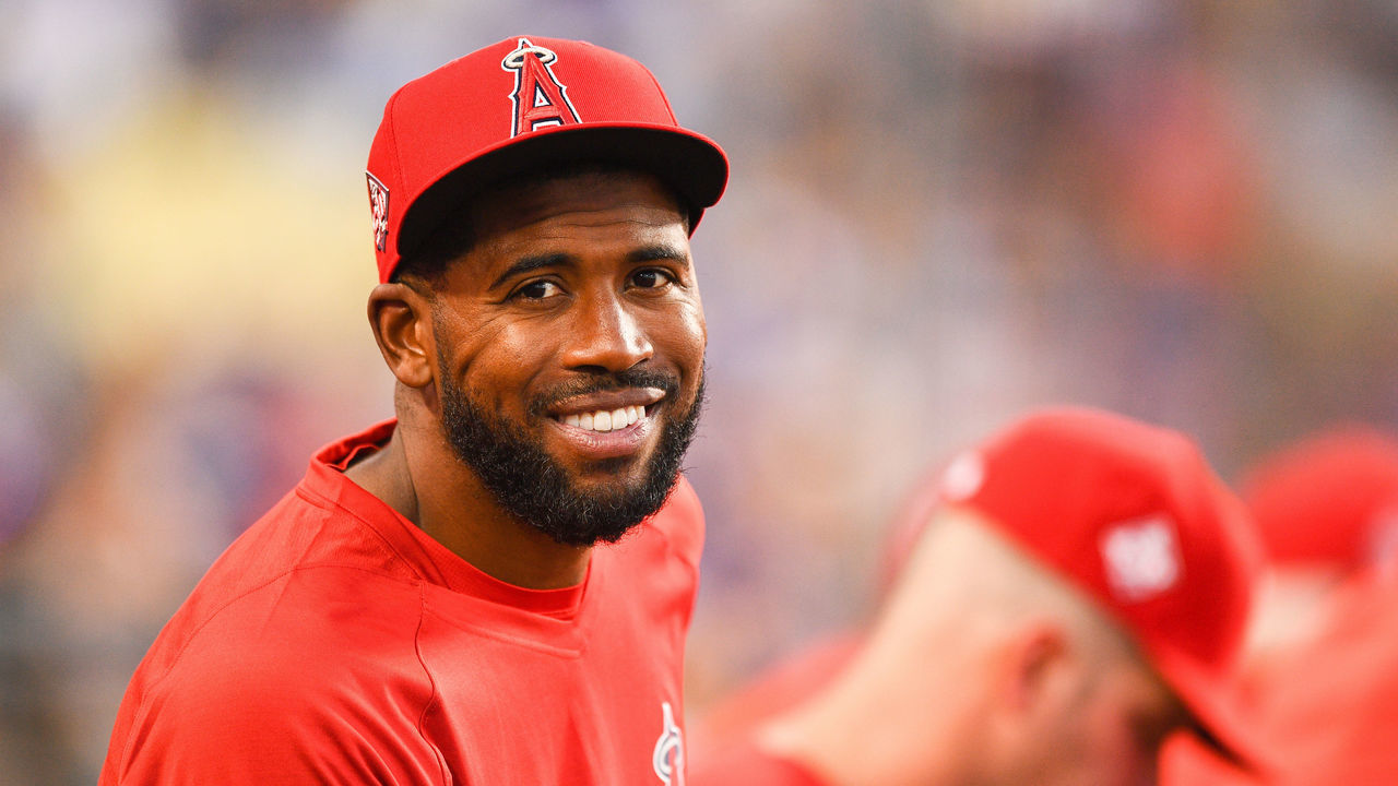 LOS ANGELES, CA - AUGUST 06: Los Angeles Angels outfielder Dexter Fowler (25) looks on in the dugout during the MLB game between the Los Angeles Angels and the Los Angeles Dodgers on August 6, 2021 at Dodger Stadium in Los Angeles, CA.