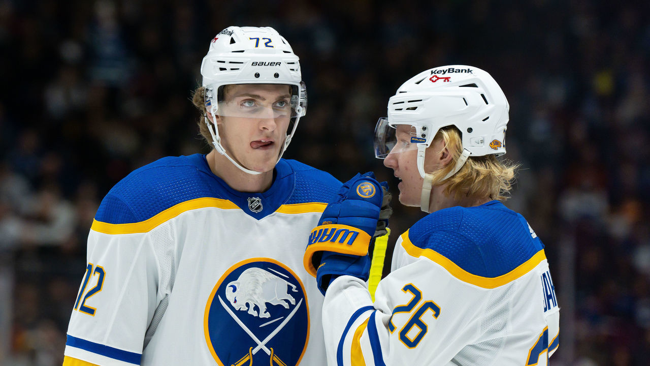 VANCOUVER, BC - MARCH 20: Buffalo Sabres right wing Tage Thompson (72) and defenseman Rasmus Dahlin (26) talk during their NHL game against the Vancouver Canucks at Rogers Arena on March 20, 2022 in Vancouver, British Columbia, Canada.