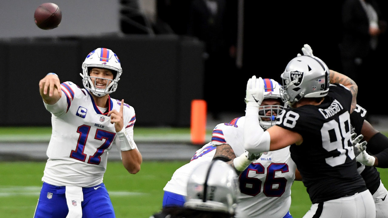 LAS VEGAS, NEVADA - OCTOBER 04: Quarterback Josh Allen #17 of the Buffalo Bills completes a pass as defensive end Maxx Crosby #98 of the Las Vegas Raiders defends during the first half of the NFL game at Allegiant Stadium on October 4, 2020 in Las Vegas, Nevada. The Bills defeated the Raiders 30-23.