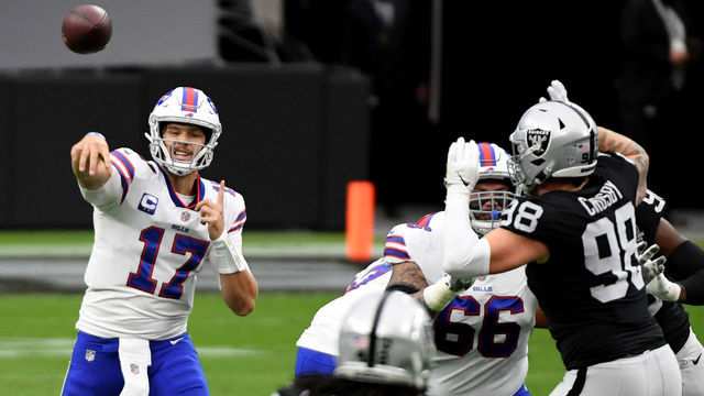 LAS VEGAS, NEVADA - OCTOBER 04: Quarterback Josh Allen #17 of the Buffalo Bills completes a pass as defensive end Maxx Crosby #98 of the Las Vegas Raiders defends during the first half of the NFL game at Allegiant Stadium on October 4, 2020 in Las Vegas, Nevada. The Bills defeated the Raiders 30-23.