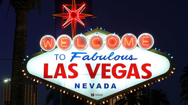 LAS VEGAS, NEVADA - FEBRUARY 28: Blue and yellow lights flicker around the border of the Welcome to Fabulous Las Vegas sign on the Las Vegas Strip as a show of support for Ukraine on February 28, 2022 in Las Vegas, Nevada. Clark County (NV) changed the colored bulbs on top, which are usually all yellow, to blue to match the flag of Ukraine, as people across the globe react to Russia's invasion of the country.