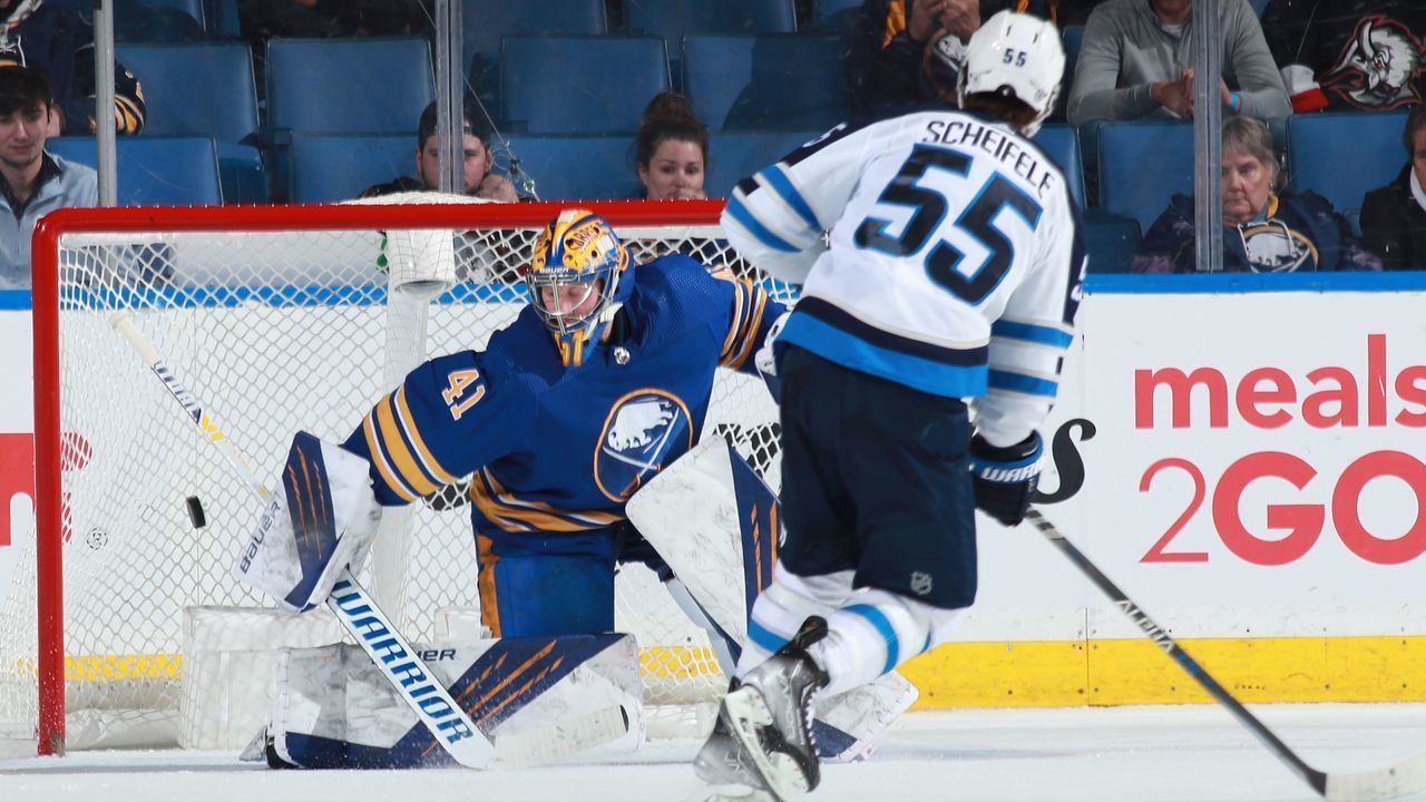 BUFFALO, NY - MARCH 30: Mark Scheifele #55 of the Winnipeg Jets scores a shootout goal against Craig Anderson #41 of the Buffalo Sabres during an NHL game on March 30, 2022 at KeyBank Center in Buffalo, New York. Winnipeg won, 3-2.