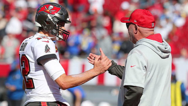 TAMPA, FL - JANUARY 23: Tampa Bay Buccaneers Quarterback Tom Brady (12) and Head Coach Bruce Arians greet one another before the NFC Divisional game between the Los Angeles Rams and the Tampa Bay Buccaneers on January 23, 2022 at Raymond James Stadium in Tampa, Florida.