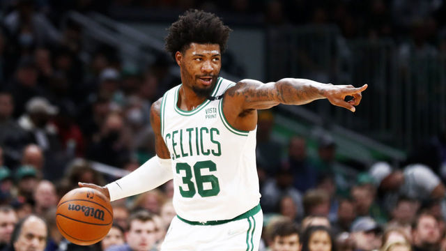 BOSTON, MASSACHUSETTS - MARCH 23: Marcus Smart #36 of the Boston Celtics brings the ball up court during the first quarter of the game against the Utah Jazz at TD Garden on March 23, 2022 in Boston, Massachusetts.