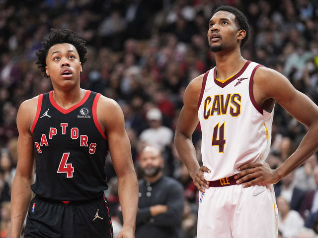 TORONTO, ON - MARCH 24: Scottie Barnes #4 of the Toronto Raptors and Evan Mobley #4 of the Cleveland Cavaliers look on in a break during the first half of their basketball game at the Scotiabank Arena on March 24, 2022 in Toronto, Ontario, Canada. NOTE TO USER: User expressly acknowledges and agrees that, by downloading and/or using this Photograph, user is consenting to the terms and conditions of the Getty Images License Agreement.