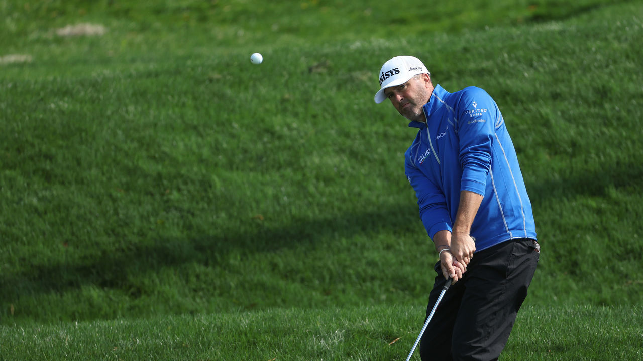 PONTE VEDRA BEACH, FLORIDA - MARCH 13: Ryan Palmer of the United States chips to the second green during the second round of THE PLAYERS Championship on the Stadium Course at TPC Sawgrass on March 13, 2022 in Ponte Vedra Beach, Florida.