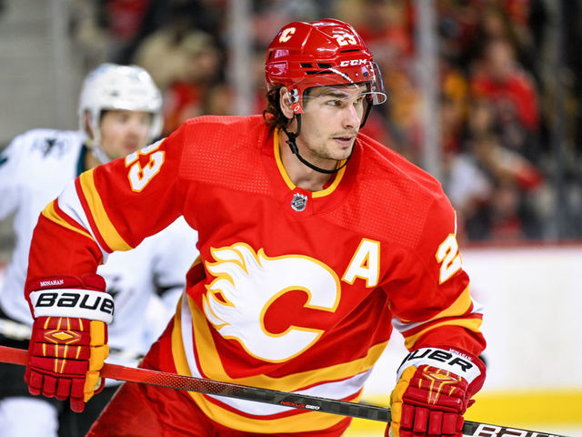 CALGARY, AB - MARCH 22: Calgary Flames Center Sean Monahan (23) in action during the second period of an NHL game where the Calgary Flames hosted the San Jose Sharks on March 22, 2022, at the Scotiabank Saddledome in Calgary, AB.