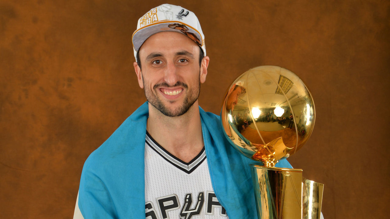 SAN ANTONIO, TX - JUNE 15: Manu Ginobili #20 of the San Antonio Spurs poses for a portrait with the Larry O'Brien Trophy after defeating the Miami Heat in Game Five of the 2014 NBA Finals on June 15, 2014 at AT&T Center in San Antonio, Texas. Mandatory Copyright Notice: Copyright 2014 NBAE