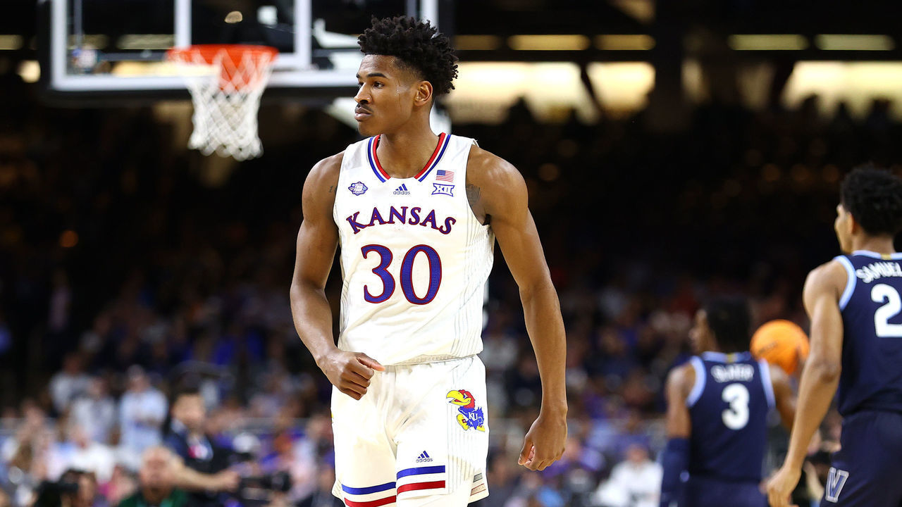 NEW ORLEANS, LOUISIANA - APRIL 02: Ochai Agbaji #30 of the Kansas Jayhawks reacts during the game against the Villanova Wildcats in the semifinal game of the 2022 NCAA Men's Basketball Tournament Final Four at Caesars Superdome on April 02, 2022 in New Orleans, Louisiana.