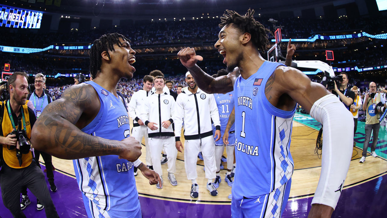 NEW ORLEANS, LOUISIANA - APRIL 02: Caleb Love #2 and Leaky Black #1 of the North Carolina Tar Heels celebrate a win against the Duke Blue Devils during the semifinal game of the 2022 NCAA Men's Basketball Tournament Final Four at Caesars Superdome on April 02, 2022 in New Orleans, Louisiana.