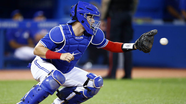 TORONTO, ON - SEPTEMBER 14: Reese McGuire #7 of the Toronto Blue Jays catches during a MLB game against the Tampa Bay Rays at Rogers Centre on September 14, 2021 in Toronto, Ontario, Canada.