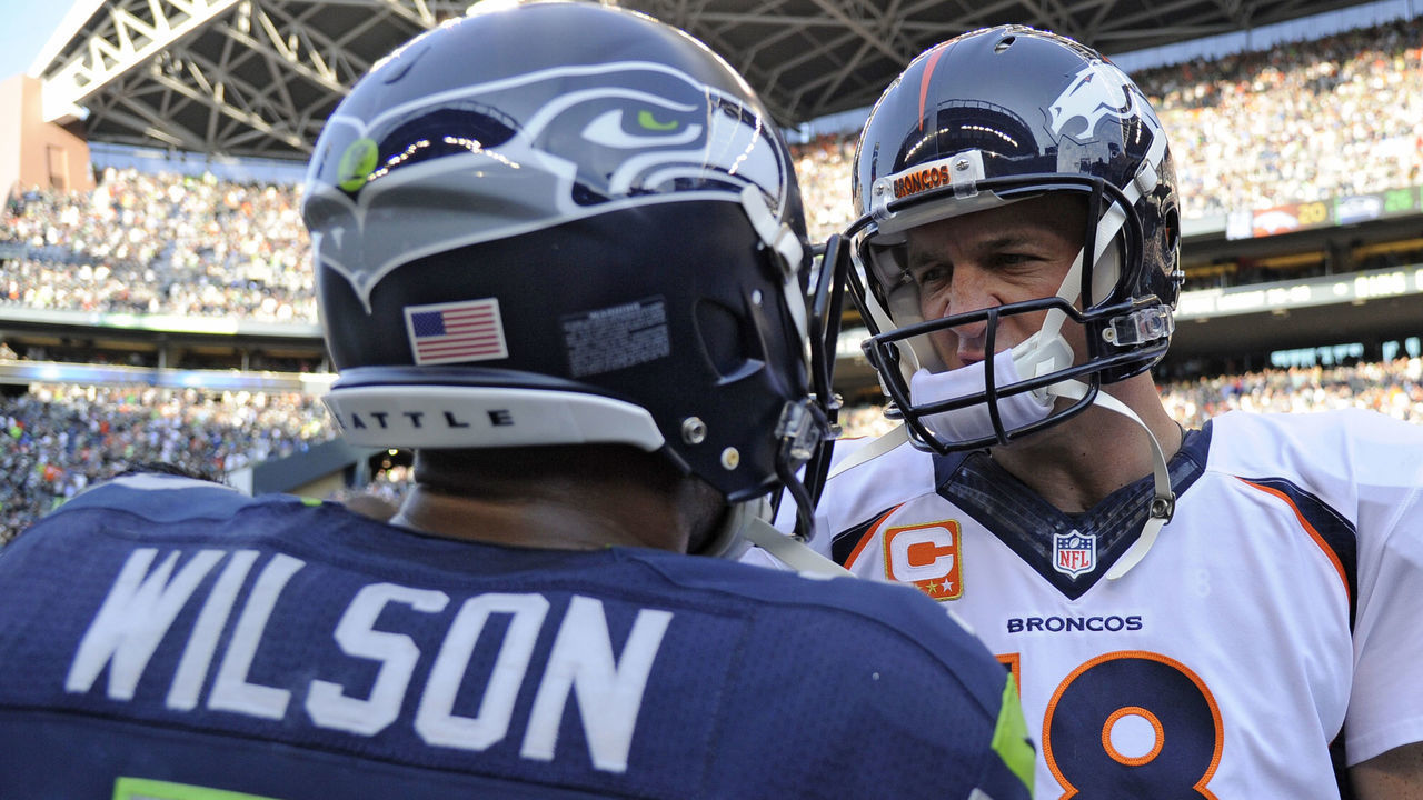 SEATTLE, WA - SEPTEMBER 21: Denver Broncos quarterback Peyton Manning (18) shakes hands with Seattle Seahawks quarterback Russell Wilson (3) after the overtime win 26-20 September 21, 2014 at CenturyLink Stadium.