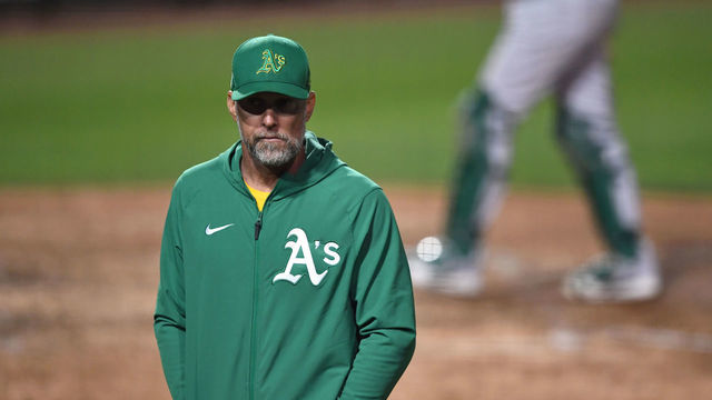 GLENDALE, AZ - MARCH 29, 2022: Manager Mark Kotsay of the Oakland Athletics walks off the field during the seventh inning of an MLB spring training game against the Los Angeles Dodgers at Camelback Ranch on March 29, 2022 in Glendale, Arizona.