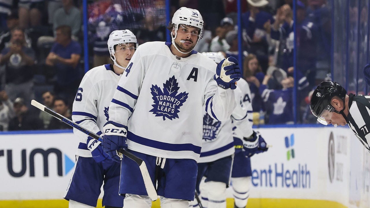 TAMPA, FL - APRIL 4: Auston Matthews #34 of the Toronto Maple Leafs celebrates his third goal of the game, completing the hat trick, against the Tampa Bay Lightning during the third period at Amalie Arena on April 4, 2022 in Tampa, Florida.