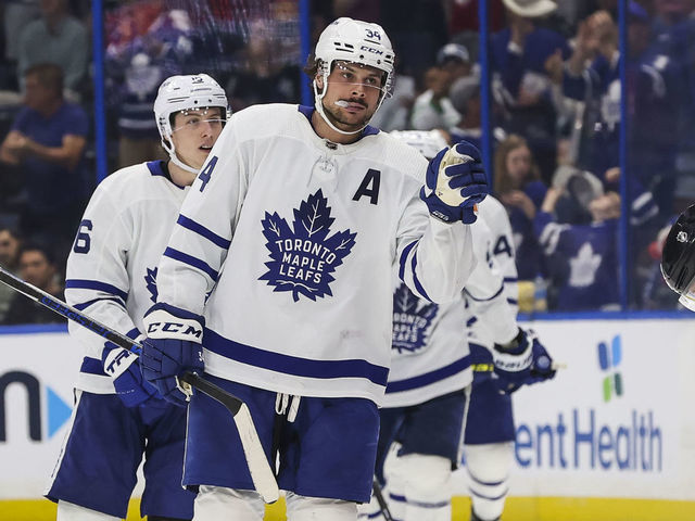 TAMPA, FL - APRIL 4: Auston Matthews #34 of the Toronto Maple Leafs celebrates his third goal of the game, completing the hat trick, against the Tampa Bay Lightning during the third period at Amalie Arena on April 4, 2022 in Tampa, Florida.