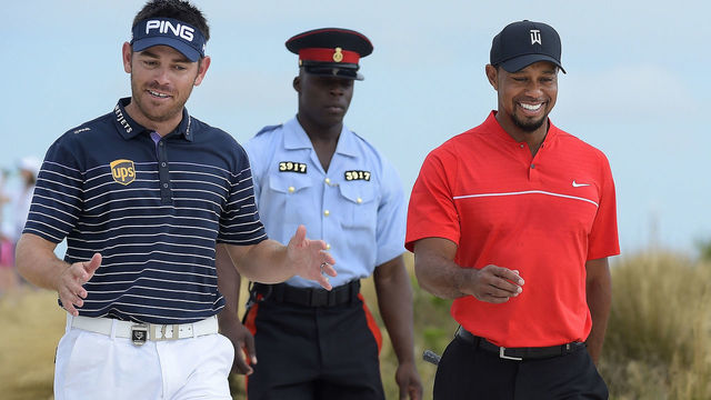 NASSAU, BAHAMAS - DECEMBER 04: (L-R) Louis Oosthuizen of South Africa and Tiger Woods walk along the seventh hole during the final round of the Hero World Challenge at Albany course on December 4, 2016 in Nassau, Bahamas.
