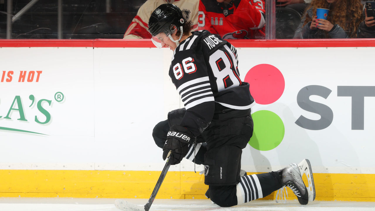 NEWARK, NJ - APRIL 03: Jack Hughes #86 of the New Jersey Devils on a knee after being hit by Oliver Wahlstrom #26 of the New York Islanders(not pictured) during the second period of the game against the New York Islanders on April 3, 2022 at the Prudential Center in Newark, New Jersey. (Rich Graessle/Getty Images)