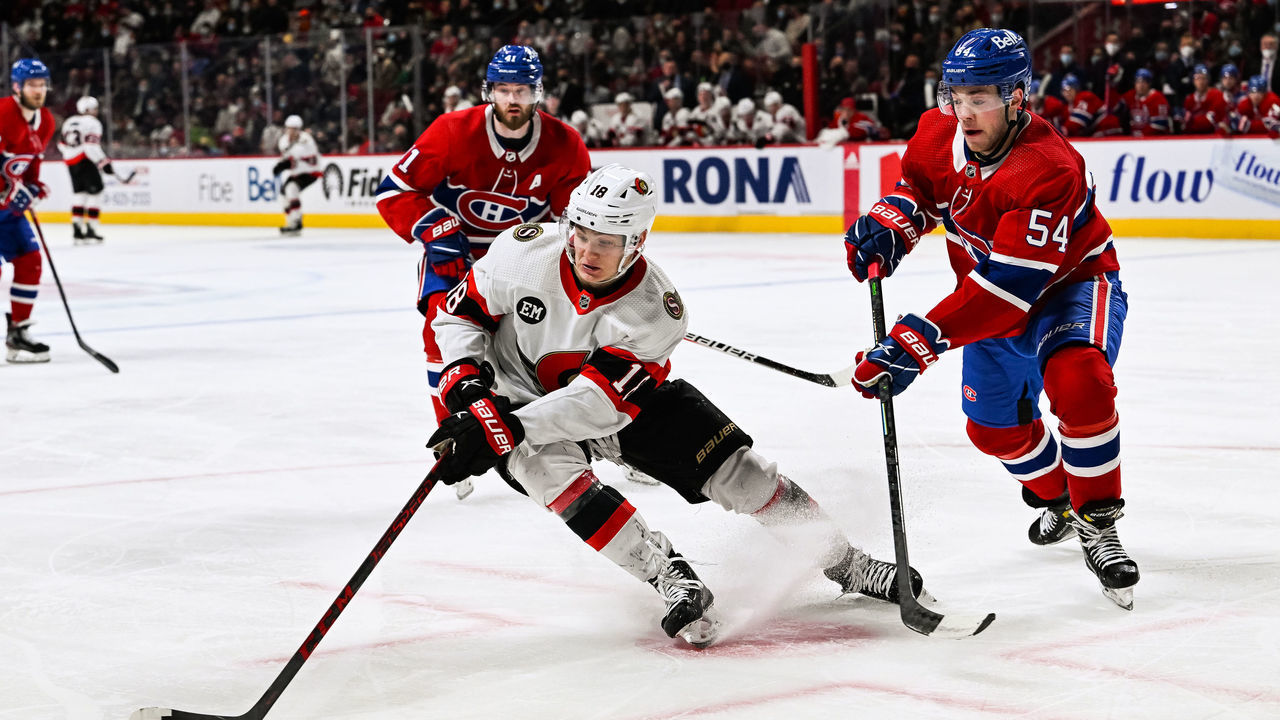 MONTREAL, QC - APRIL 05: Ottawa Senators left wing Tim Stutzle (18) plays the puck against Montreal Canadiens defenceman Jordan Harris (54) during the Ottawa Senators versus the Montreal Canadiens game on April 05, 2022 at Bell Centre in Montreal, QC