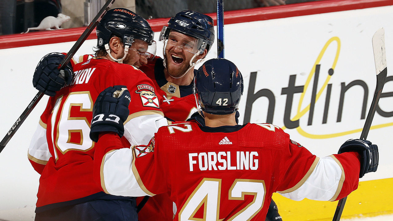 SUNRISE, FL - APRIL 5: Aleksander Barkov #16 of the Florida Panthers celebrates his goal with teammates Jonathan Huberdeau #11 and Gustav Forsling #42 in the third period against the Toronto Maple Leafs at the FLA Live Arena on April 5, 2022 in Sunrise, Florida.