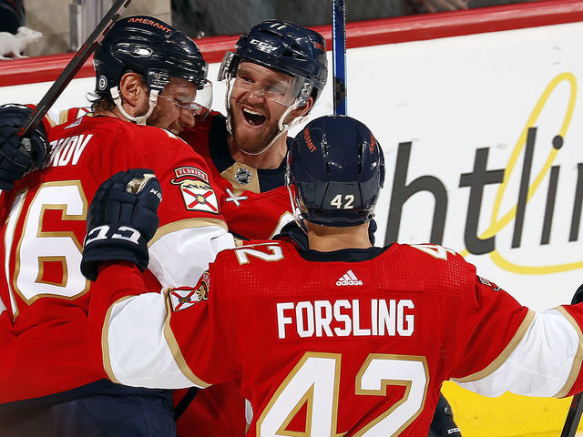 SUNRISE, FL - APRIL 5: Aleksander Barkov #16 of the Florida Panthers celebrates his goal with teammates Jonathan Huberdeau #11 and Gustav Forsling #42 in the third period against the Toronto Maple Leafs at the FLA Live Arena on April 5, 2022 in Sunrise, Florida.