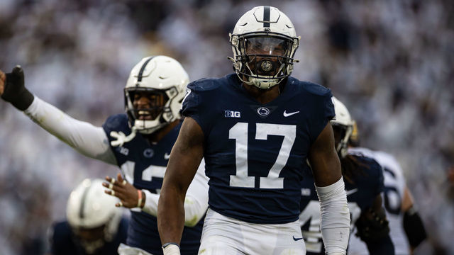 STATE COLLEGE, PA - NOVEMBER 13: Arnold Ebiketie #17 of the Penn State Nittany Lions celebrates with Ellis Brooks #13 after causing a fumble against the Michigan Wolverines during the second half at Beaver Stadium on November 13, 2021 in State College, Pennsylvania.