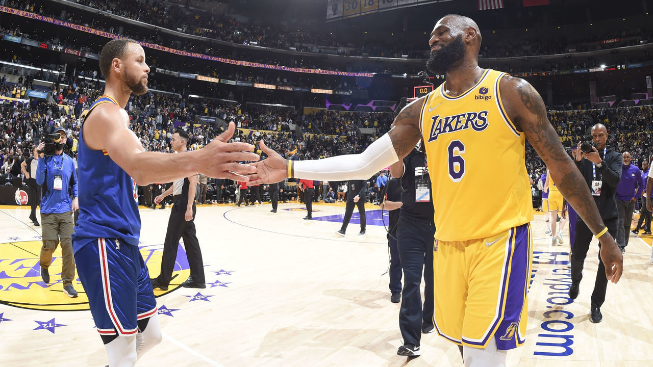 LOS ANGELES, CA - MARCH 5: LeBron James #6 of the Los Angeles Lakers high fives Stephen Curry #30 of the Golden State Warriors after the game on March 5, 2022 at Crypto.Com Arena in Los Angeles, California. NOTE TO USER: User expressly acknowledges and agrees that, by downloading and/or using this Photograph, user is consenting to the terms and conditions of the Getty Images License Agreement. Mandatory Copyright Notice: Copyright 2022 NBAE