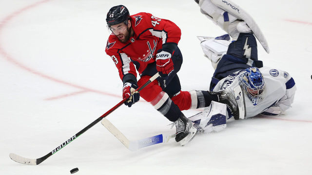 WASHINGTON, DC - APRIL 06: Tom Wilson #43 of the Washington Capitals is tripped by goalie Andrei Vasilevskiy #88 of the Tampa Bay Lightning during the third period at Capital One Arena on April 6, 2022 in Washington, DC.