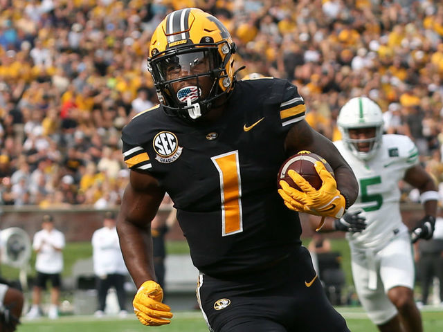 COLUMBIA, MO - OCTOBER 09: Missouri Tigers running back Tyler Badie (1) during a 12-yard touchdown run in the first quarter of a college football game between the North Texas Mean Green and Missouri Tigers on Oct 9, 2021 at Memorial Stadium in Columbia, MO.