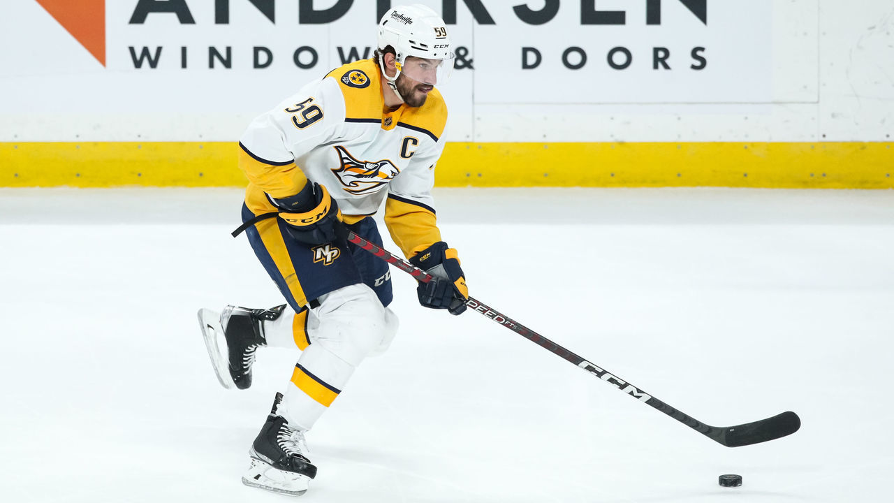 ST PAUL, MN - MARCH 13: Roman Josi #59 of the Nashville Predators skates with the puck against the Minnesota Wild in the third period of the game at Xcel Energy Center on March 13, 2022 in St Paul, Minnesota. The Predators defeated the Wild 6-2.