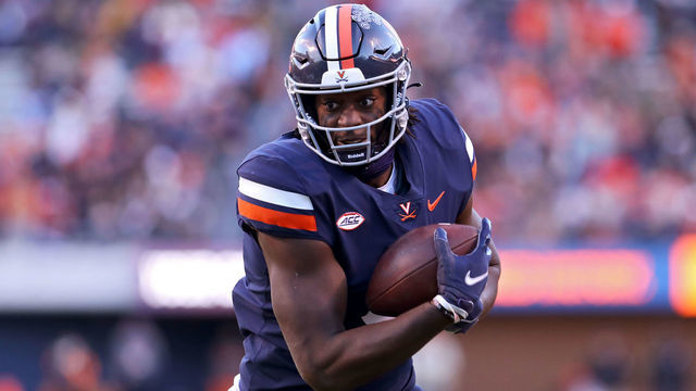 CHARLOTTESVILLE, VA - NOVEMBER 27: Jelani Woods #0 of the Virginia Cavaliers catches a pass in the first half during a game against the Virginia Tech Hokies at Scott Stadium on November 27, 2021 in Charlottesville, Virginia.