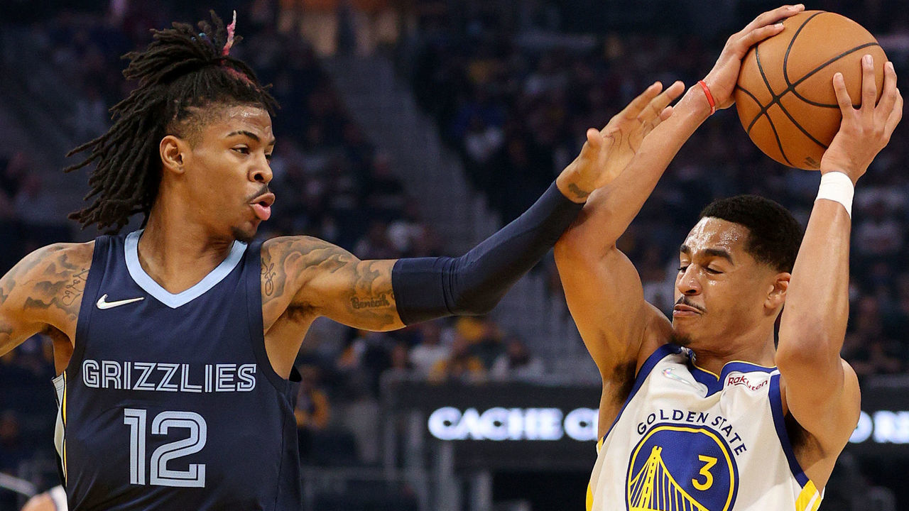 SAN FRANCISCO, CALIFORNIA - OCTOBER 28: Jordan Poole #3 of the Golden State Warriors is guarded by Ja Morant #12 of the Memphis Grizzlies during the first half at Chase Center on October 28, 2021 in San Francisco, California. NOTE TO USER: User expressly acknowledges and agrees that, by downloading and/or using this photograph, User is consenting to the terms and conditions of the Getty Images License Agreement.