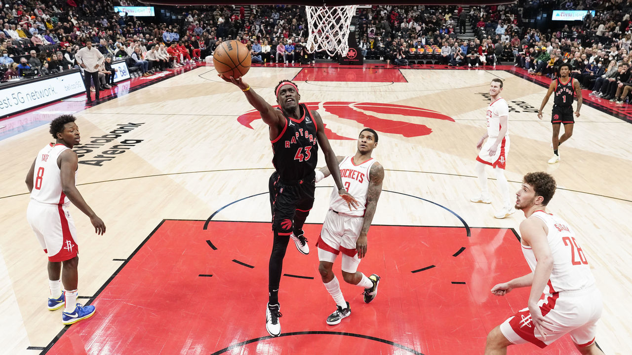 TORONTO, ON - APRIL 8: Pascal Siakam #43 of the Toronto Raptors goes to the basket against Alperen Sengun #28, Kevin Porter Jr. #3, and Jae'Sean Tate #8 of the Houston Rockets during the first half of their basketball game at the Scotiabank Arena on April 8, 2022 in Toronto, Ontario, Canada. NOTE TO USER: User expressly acknowledges and agrees that, by downloading and/or using this Photograph, user is consenting to the terms and conditions of the Getty Images License Agreement.