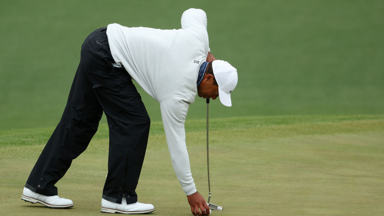 AUGUSTA, GEORGIA - APRIL 09: Tiger Woods lines up a putt on the second green during the third round of the Masters at Augusta National Golf Club on April 09, 2022 in Augusta, Georgia.
