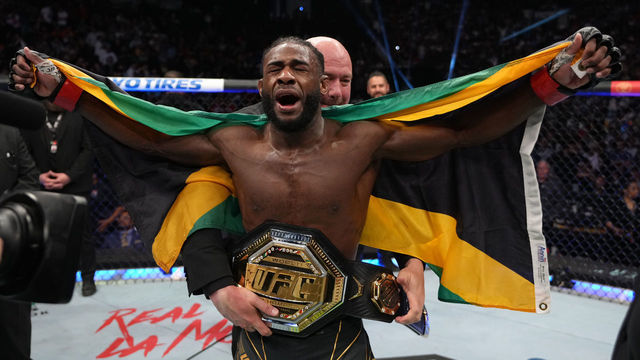JACKSONVILLE, FLORIDA - APRIL 09: Aljamain Sterling celebrates after defeating Petr Yan of Russia in their UFC bantamweight championship fight during the UFC 273 event at VyStar Veterans Memorial Arena on April 09, 2022 in Jacksonville, Florida.