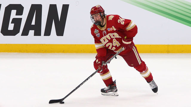BOSTON, MA - APRIL 07: Denver Pioneers forward Bobby Brink (24) with the puck during the Frozen Four of the Men's Div I NCAA Hockey Championship between Denver Pioneers and Michigan Wolverines on April 7, 2022, at TD Garden in Boston, MA.