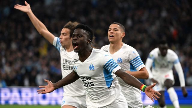 Marseille's Senegalese forward Bamba Dieng celebrates scoring his team's first goal during the French L1 football match between Olympique de Marseille (OM) and SC Montpellier at the Velodrome Stadium in Marseille, southern France, on April 10, 2022.
